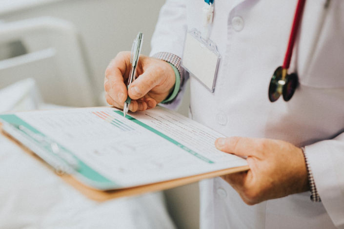 a doctor holding medical reports